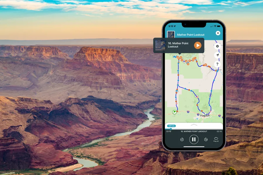 Smartphone displaying the Shaka Guide app over a Grand Canyon view with layered cliffs and a winding river cutting through the canyon below.