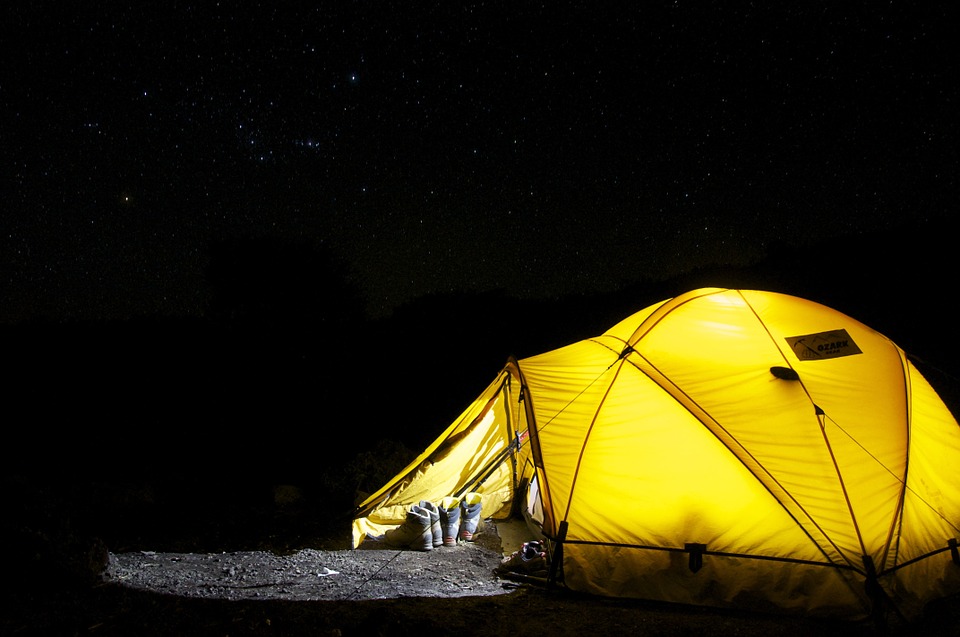 yellow tent on a dark night