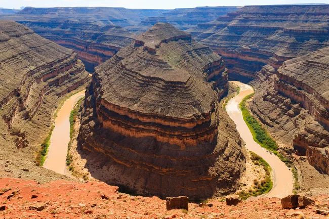 San Juan River meanders through deep, looping canyons at Goosenecks State Park, Utah.