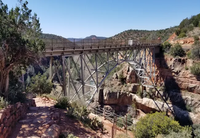 Midgley Bridge spans a deep canyon in Sedona, offering scenic views and access to nearby hiking trails.