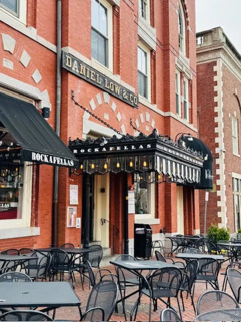 Outdoor dining setup in front of Rockafellas restaurant, located in the historic Daniel Low & Co. building in Salem, Massachusetts.