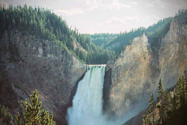 waterfalls between two small mountains