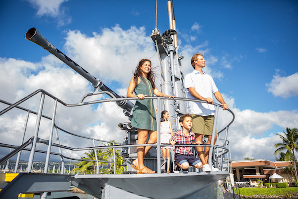 family standing at pearl harbor museum