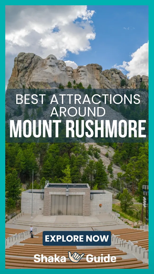 Outdoor amphitheater facing a large mountain carving of four historical figures under a partly cloudy sky with trees below.