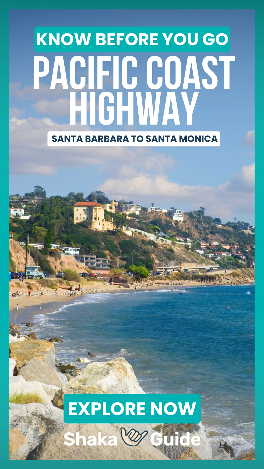 A vertical travel graphic featuring a sun-drenched coastal view of a sandy beach and a hillside lined with multi-story homes. In the foreground, large white and tan boulders act as a sea wall against the bright blue ocean. The background shows the Pacific Coast Highway running along the base of the hills under a blue sky with fluffy white clouds. Bold white text at the top reads "KNOW BEFORE YOU GO - PACIFIC COAST HIGHWAY - MALIBU, SANTA BARBARA & SANTA MONICA," with an "EXPLORE NOW" button and the Shaka Guide logo at the bottom.