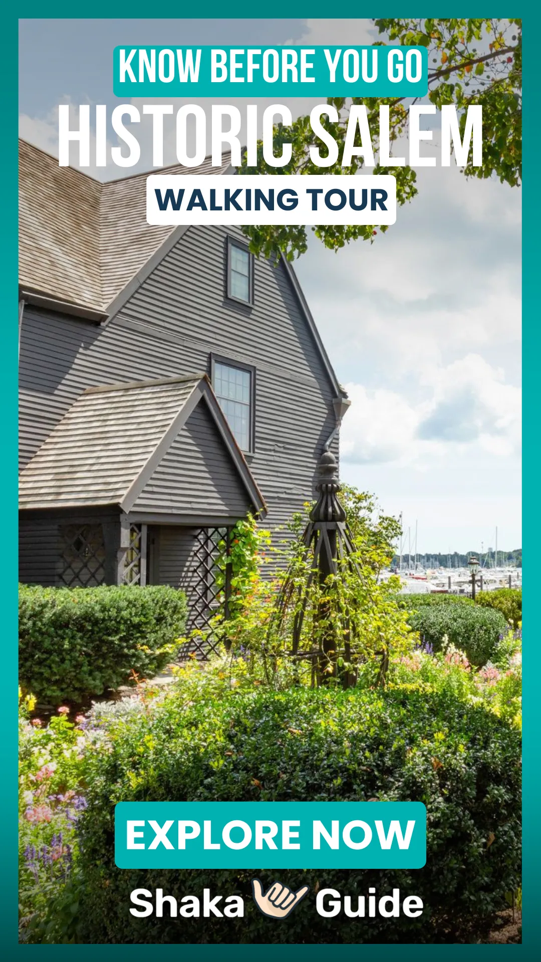 Historic black house with garden in full bloom, overlooking Salem Harbor under a bright summer sky.