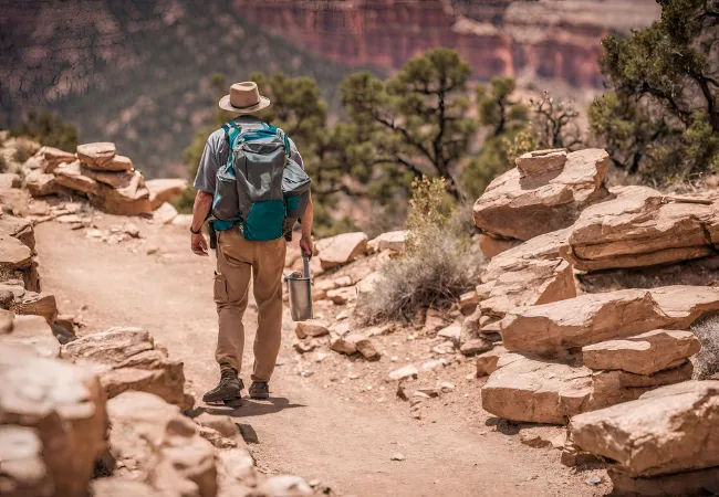 hiker walking in trails south rim