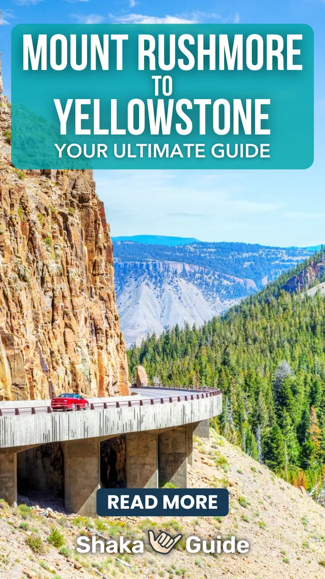 A red car drives along a scenic cliffside highway surrounded by forested mountains, with bold text reading “Mount Rushmore to Yellowstone — Your Ultimate Guide” by Shaka Guide.