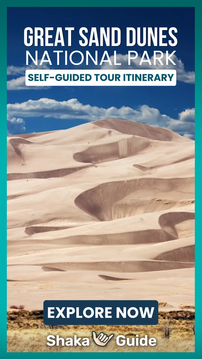Promotional image for Great Sand Dunes National Park self-guided tour itinerary, showing sweeping golden dunes under a vivid blue sky.